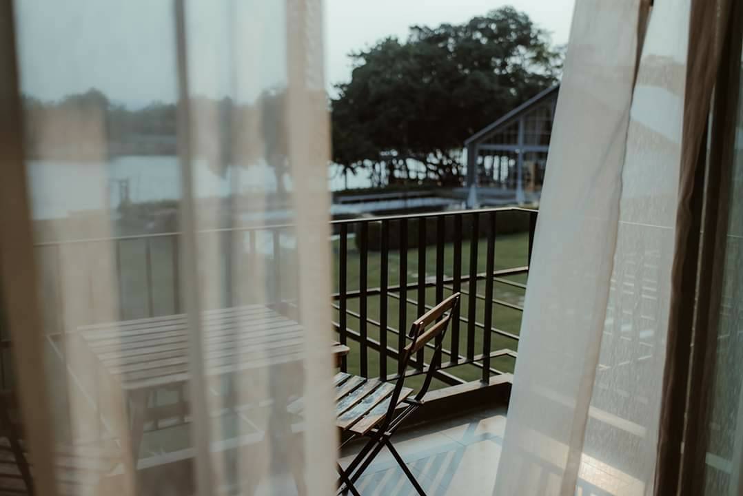 Curtains and balcony at The Zeit River Kwai