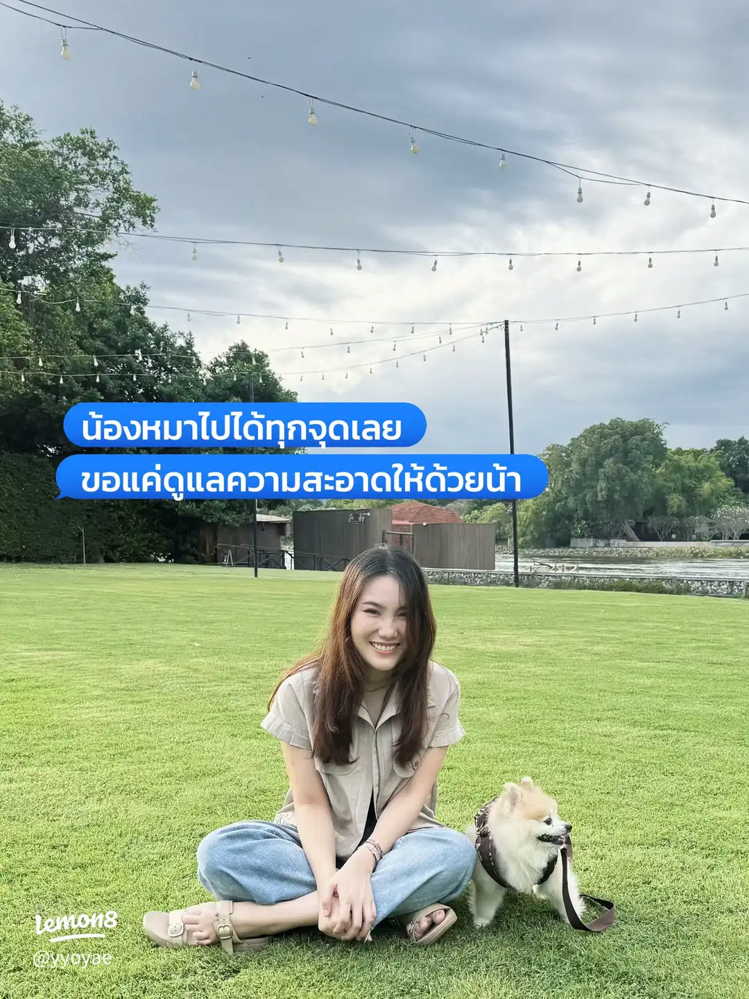 A guest and her dog by the river during a The Zeit stay