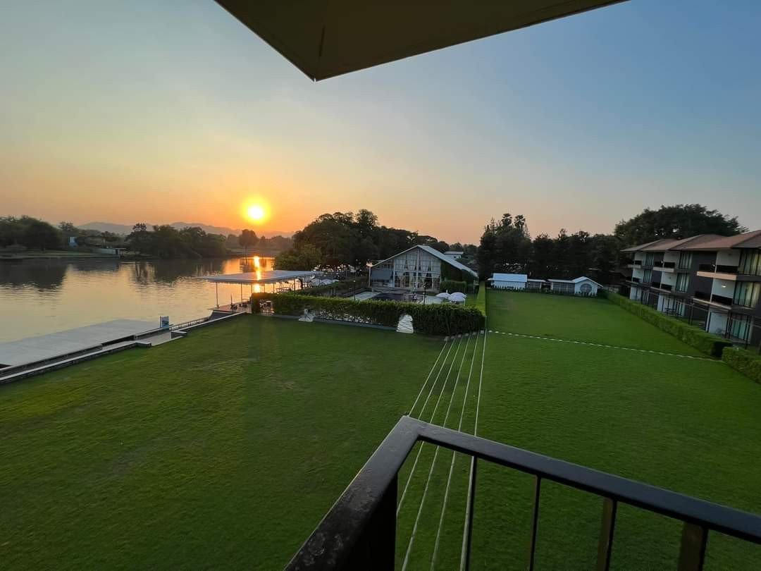 Evening view across the hotel lawn and River Kwai