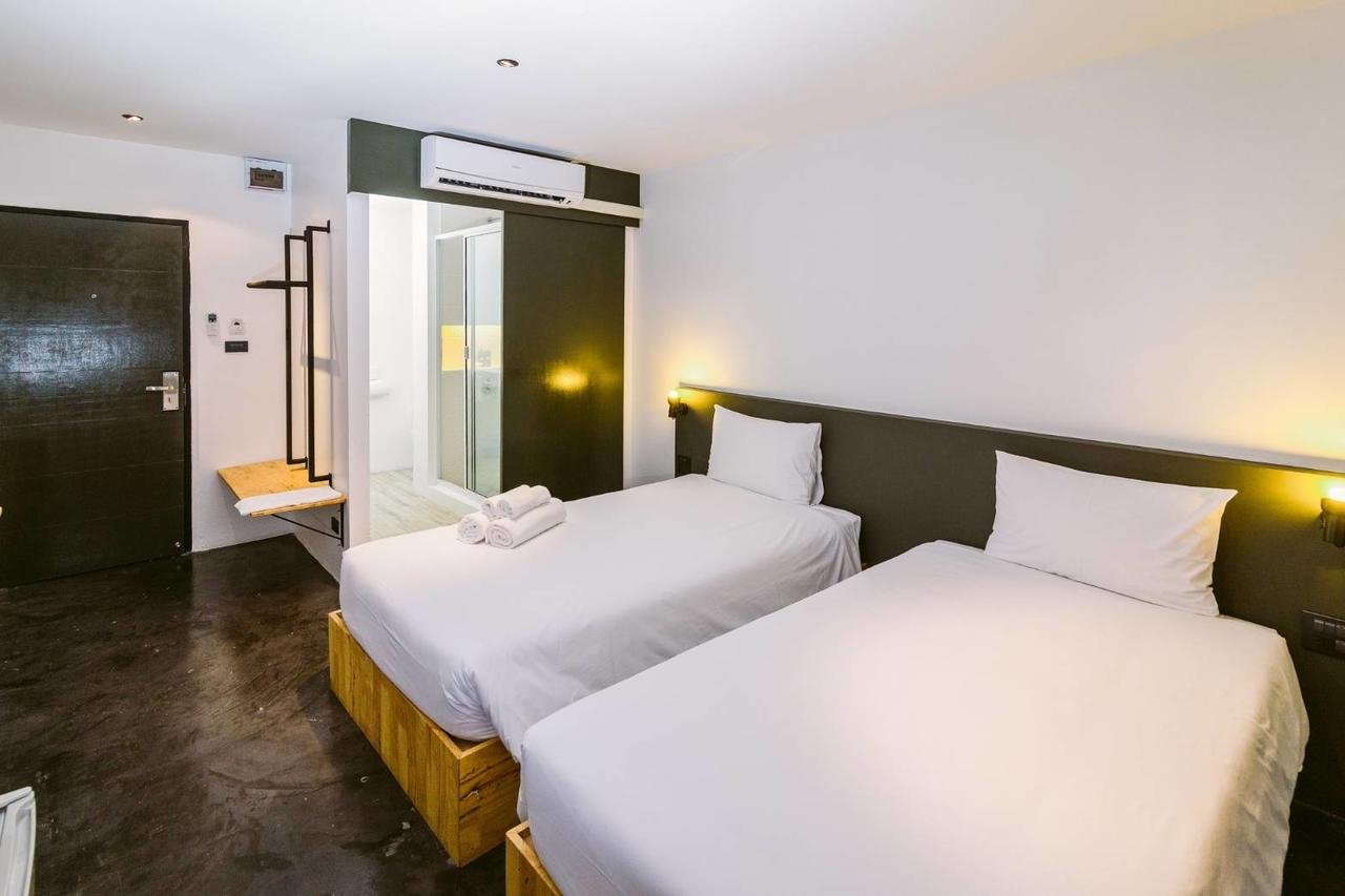 A wider view of a twin room at The Zeit River Kwai